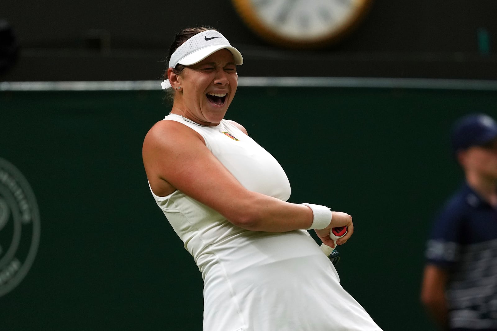 Amanda Anisimova of the U.S. reacts during her women's singles fourth round match against Linda Noskova of Czech Republic at the Wimbledon Tennis Championships in London, Sunday, July 6, 2025.(AP Photo/Joanna Chan)
