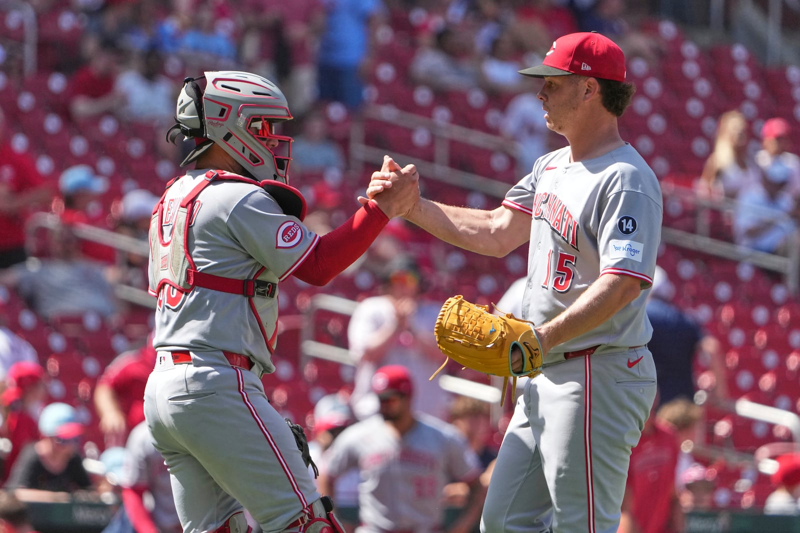 Cincinnati Reds relief pitcher Emilio Pagan (15) and catcher Jose Trevino celebrate a victory over the St. Louis Cardinals in a baseball game Sunday, June 22, 2025, in St. Louis. (AP Photo/Jeff Roberson)