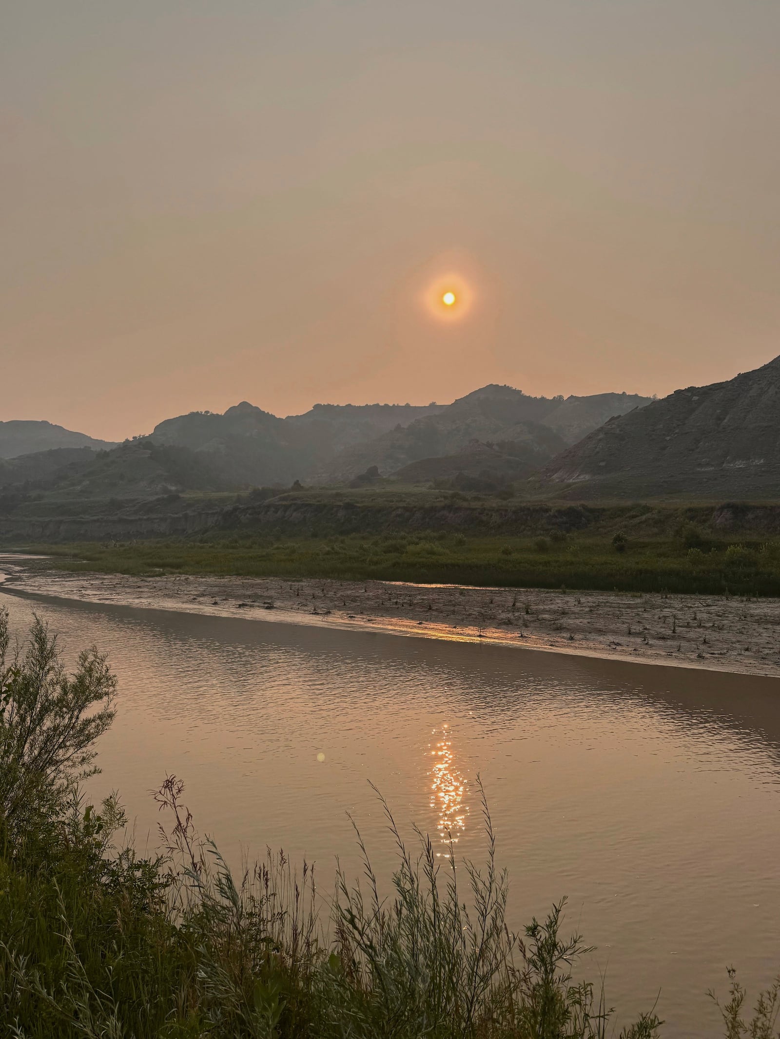 This photo taken by Joel Crane shows smoky skies on Friday, July 11, 2025, near Medora, N.D.. (Joel Crane via AP)
