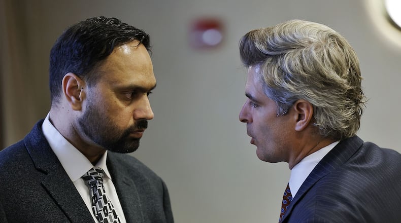 Defense attorney Charles M. Rittgers, right, speaks with his client Gurpreet Singh, charged in a quadruple homicide in West Chester Township, during a hearing in Butler County Common Pleas Court Wednesday, Nov. 10, 2021 in Hamilton. NICK GRAHAM / STAFF