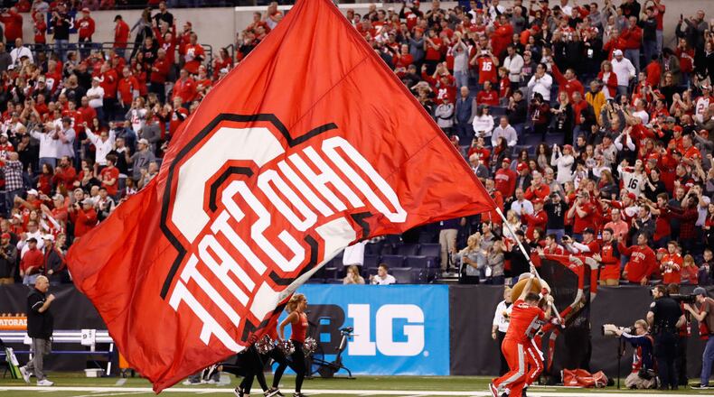 INDIANAPOLIS, IN - DECEMBER 02:  The Ohio State Buckeyes cheerleaders perform holding a flag while playing against the Wisconsin Badgers during the Big Ten Championship game at Lucas Oil Stadium on December 2, 2017 in Indianapolis, Indiana.  (Photo by Andy Lyons/Getty Images)