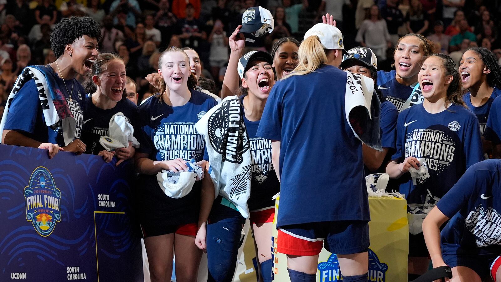 UConn players react during the trophy ceremony after defeating South Carolina in the national championship game at the Final Four of the women's NCAA college basketball tournament, Sunday, April 6, 2025, in Tampa, Fla. (AP Photo/John Raoux)