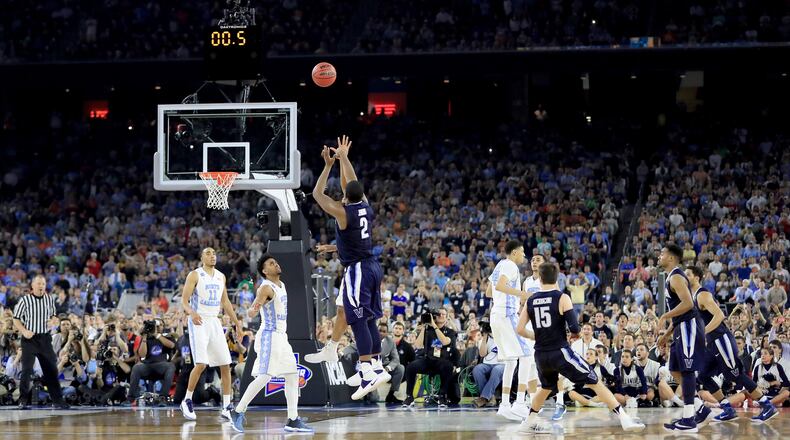 HOUSTON, TEXAS - APRIL 04: Kris Jenkins #2 of the Villanova Wildcats shoots the game-winning three pointer to defeat the North Carolina Tar Heels 77-74 in the 2016 NCAA Men's Final Four National Championship game at NRG Stadium on April 4, 2016 in Houston, Texas. (Photo by Ronald Martinez/Getty Images)