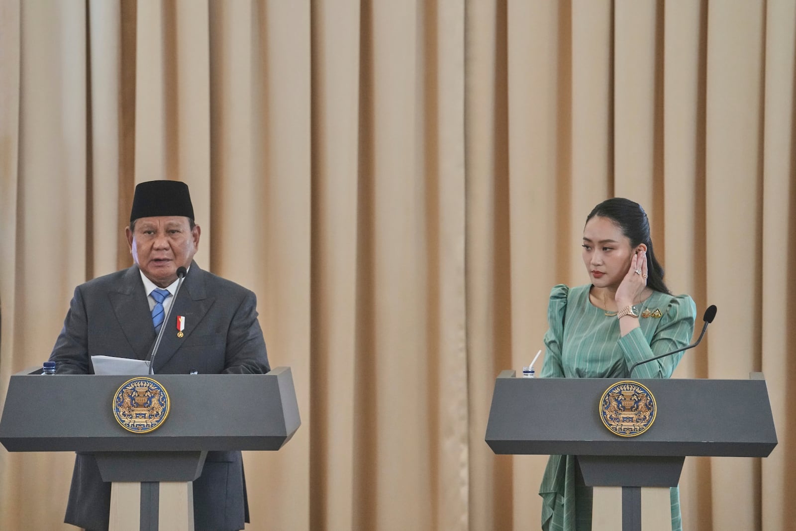 Indonesian President Prabowo Subianto, left, speaks as Thailand's Prime Minister Paetongtarn Shinawatra listens during their joint press conference at the government house in Bangkok, Thailand, Monday, May 19, 2025. (AP Photo/Sakchai Lalit)