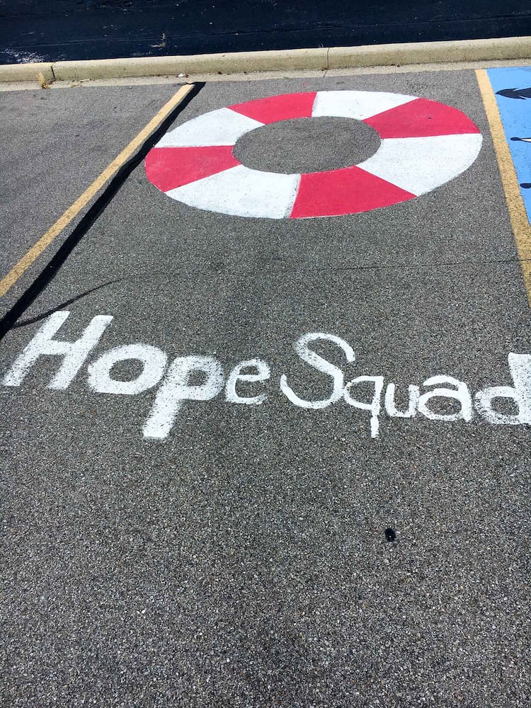 PHOTOS Lakota East seniors paint parking spots