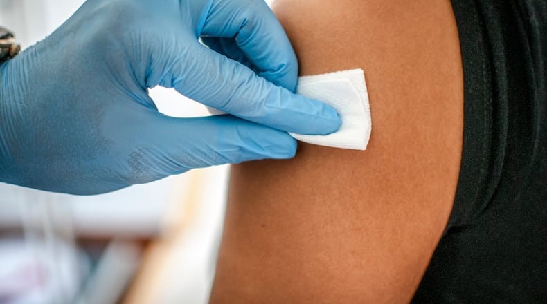 A nurse prepares to give a vaccine at Public Health - Dayton and Montgomery County. Doctors and health experts say it is not too late to get a flu vaccine as the Dayton region continues to experience the most flu-related hospitalizations in Ohio this season. CONTRIBUTED