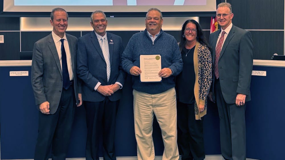 Liberty Twp.’s retiring services director Rick Plummer received a proclamation of appreciation from trustees, from left, Steve Schramm, Tom Farrell, Plummer, Caroline McKinney (township administrator) and Todd Minniear. LIBERTY TWP./CONTRIBUTED