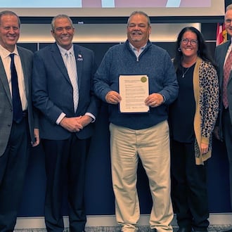 Liberty Twp.’s retiring services director Rick Plummer received a proclamation of appreciation from trustees, from left, Steve Schramm, Tom Farrell, Plummer, Caroline McKinney (township administrator) and Todd Minniear. LIBERTY TWP./CONTRIBUTED