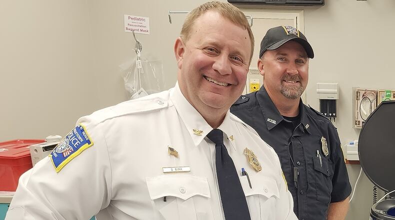 Middletown Division of Police chief David Birk, left, is shown in file photo involving barricade buckets distributed to Middletown school classrooms. Birk has been on paid leave since Dec. 20, 2023. NICK GRAHAM/STAFF