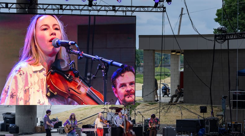 The RiversEdge canopy was one of the projects included in a Bond Anticipation Note initially issued in 2024. The city is refinancing that note along with borrowing an additional $4 million. Pictured are a pair of acts — Bronwyn Keith-Hynes and Clay Street Unit — performing at the renovated RiversEdge on June 6, 2025. THOMAS PATE/NARRATUS MEDIA
