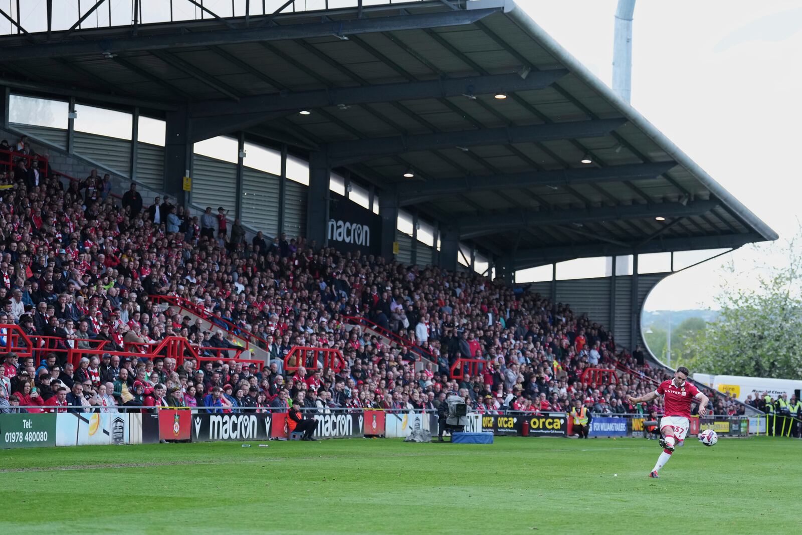 Wrexham's Matty James kicks the ball during the English League One soccer match between Wrexham and Charlton Athletic at the Racecourse ground in Wrexham, Wales, Saturday, April 26, 2025. (AP Photo/Jon Super)