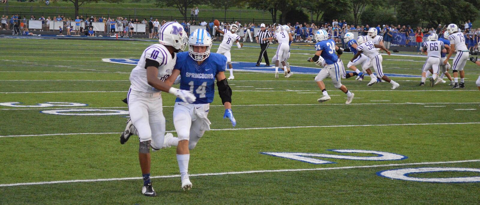 Middletown quarterback Jarrenn Thomas (8) prepares to launch a bomb toward teammate Will Williams (10) as Springboro’s Jared McCarthy defends during Friday night’s game at CareFlight Field in Springboro. CONTRIBUTED PHOTO BY ERIC FRANTZ