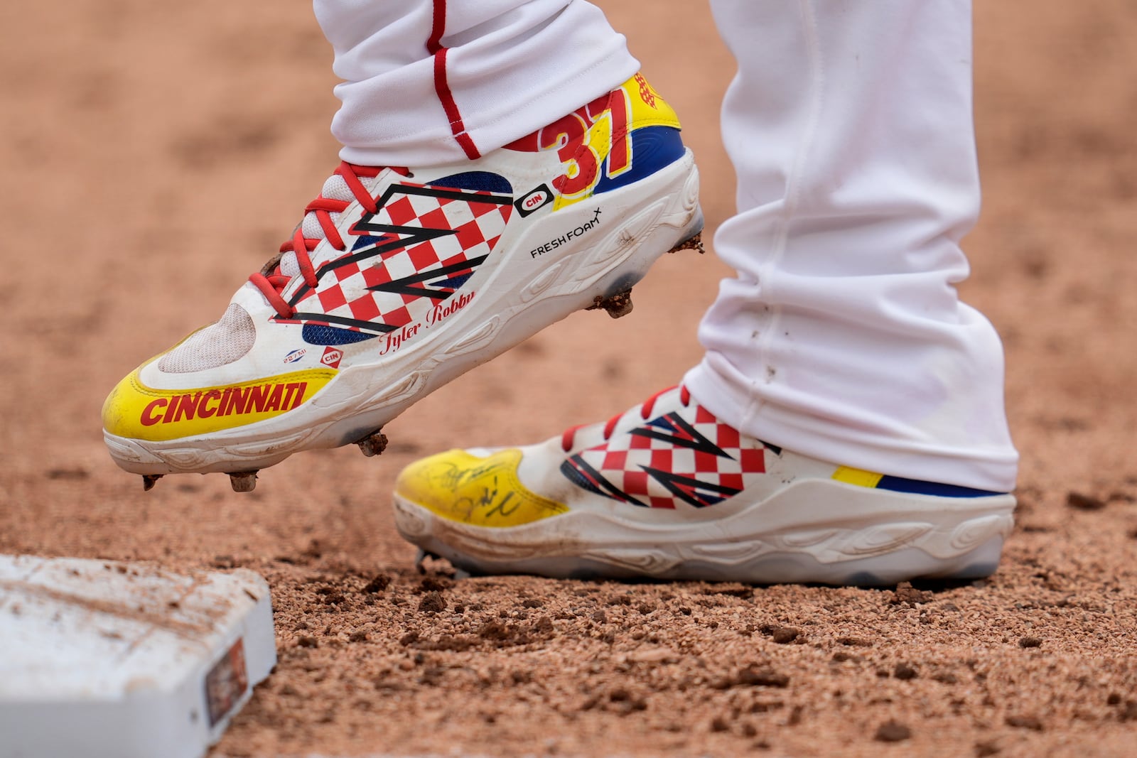 Cincinnati Reds' Tyler Stephenson stands on first during the eighth inning of the MLB Speedway Classic baseball game against the Atlanta Braves at Bristol Motor Speedway in Bristol, Tenn., Sunday, Aug. 3, 2025. Play was resumed today after yesterday's weather delay. (AP Photo/George Walker IV)