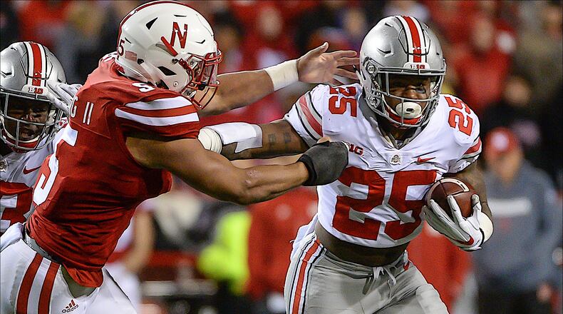 LINCOLN, NE - OCTOBER 14: Running back Mike Weber #25 of the Ohio State Buckeyes runs from linebacker Dedrick Young II #5 of the Nebraska Cornhuskers at Memorial Stadium on October 14, 2017 in Lincoln, Nebraska. (Photo by Steven Branscombe/Getty Images)