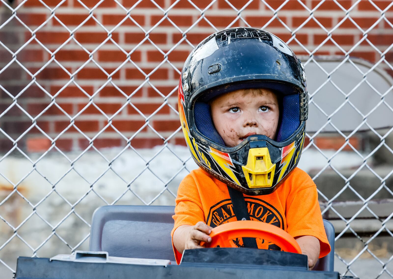 Brian Wallace, 2, gets ready for the kids' demolition derby at the Butler County Fair Friday, July 30, 2021, in Hamilton. NICK GRAHAM / STAFF