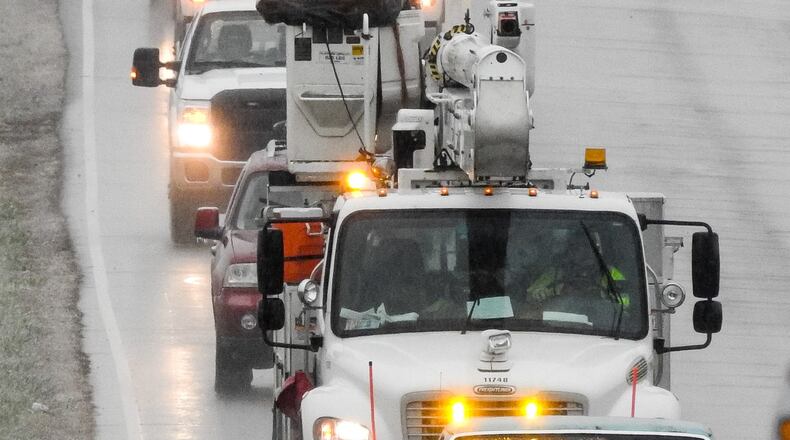 Ice caused many problems with power outages and fallen trees around Butler County Thursday, Nov. 15. Pictured are Duke Energy trucks on Carmody Boulevard in Middletown.