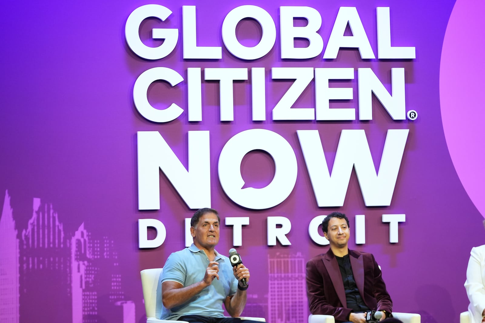 Mark Cuban, left, speaks with Andrew Leon Hanna, on a panel at a Global Citizen NOW event in Detroit, Thursday, July 10, 2025. (AP Photo/Paul Sancya)