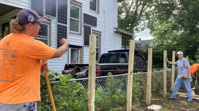 Volunteers from SELF work on repairing a Middletown home. The Butler County agency recently received more than $800,000 to expand its services throughout the county. SUBMITTED PHOTO