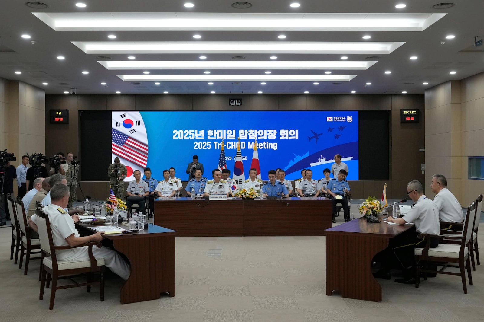 Delegation of South Korea, center, Japan, and the U.S., left, attend a Trilateral Chiefs of Defense meeting at the Defense Ministry in Seoul, South Korea, Friday, July 11, 2025. (AP Photo/Ahn Young-joon, Pool)