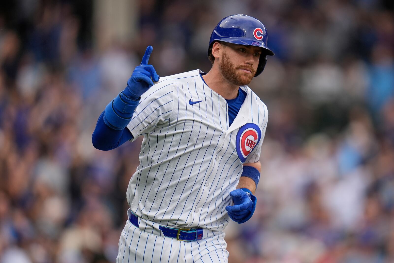 CORRECTS TO THREE-RUN HOME RUN NOT TWO-RUN HOME RUN - Chicago Cubs' Kyle Tucker runs the bases after hitting a three-run home run during the eighth inning of a baseball game against the Arizona Diamondbacks, Friday, April 18, 2025, in Chicago. (AP Photo/Erin Hooley)