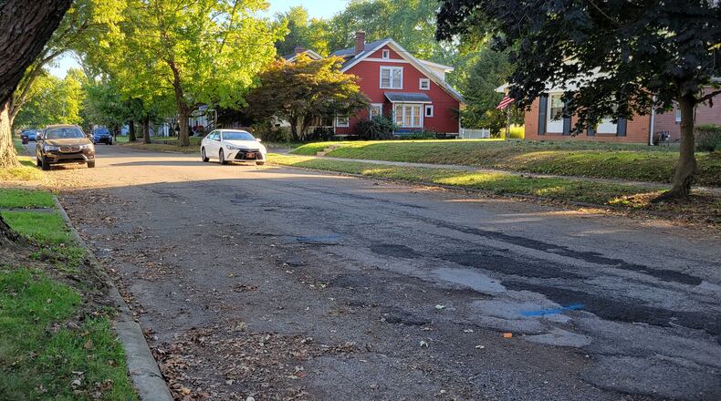 A section of road along King Street in Xenia has been patched many times over the years, to the point residents say they avoid driving over it. Xenia voters will consider a levy this fall intended to fix streets like this one. LONDON BISHOP / STAFF