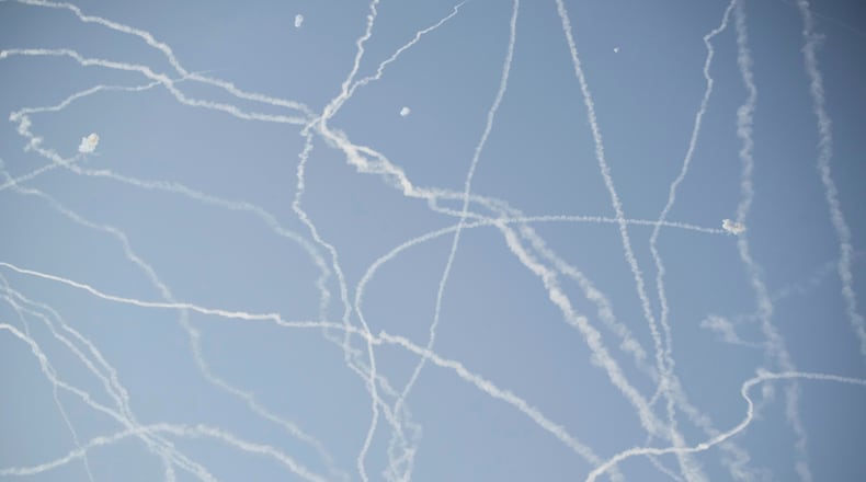 FILE - Israeli air defense system fires to intercept missiles during an Iranian attack over Tel Aviv, Israel, Thursday, June 19, 2025. (AP Photo/Leo Correa, File)
