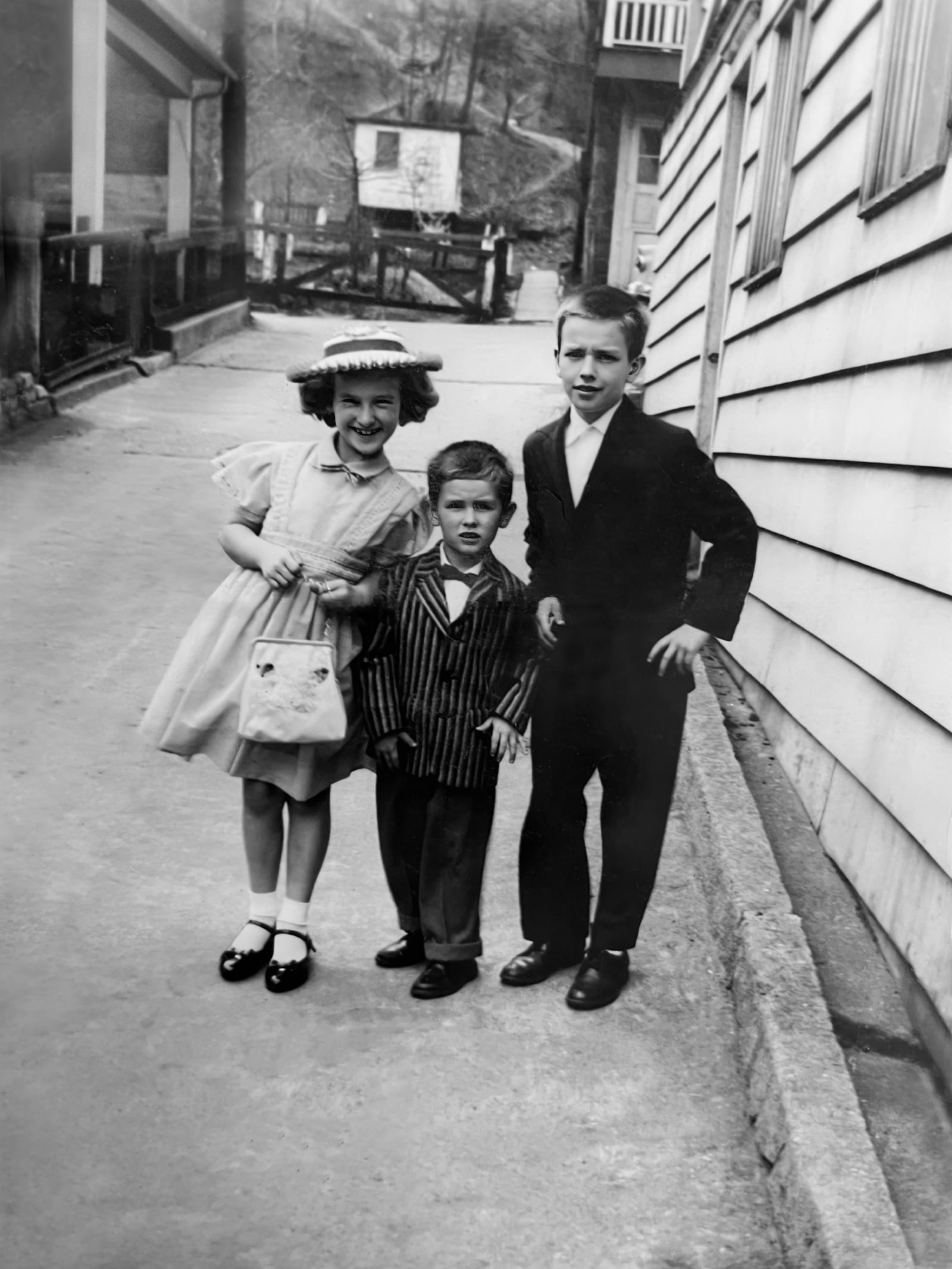 Lawrence Mieczkowski (center) on Easter Sunday in 1960 with his sister Mary Ellen (left) and brother Bob (right). All three children, along with their four older siblings, were raised by abusive parents. CONTRIBUTED