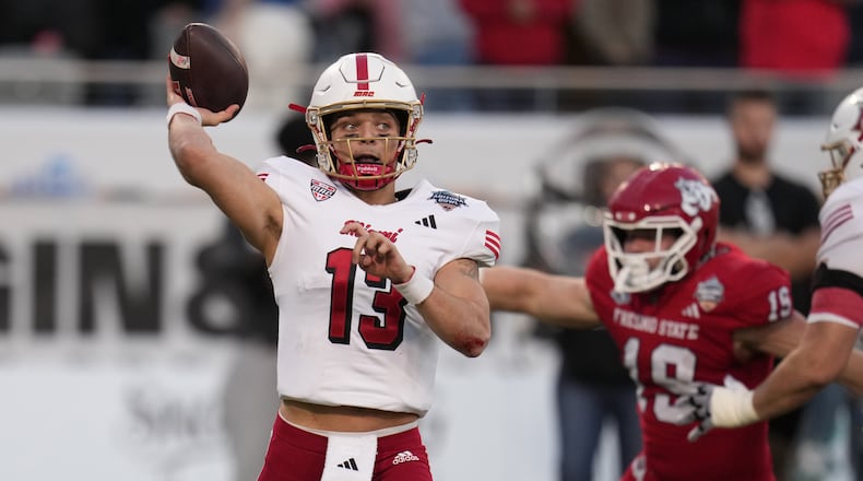 Miami (Ohio) quarterback Thomas Gotkowski (13) throws the ball against Fresno State in the second half of the Snoop Dogg Arizona Bowl NCAA college football game Saturday, Dec. 27, 2025, in Tucson, Ariz. (AP Photo/Rick Scuteri)
