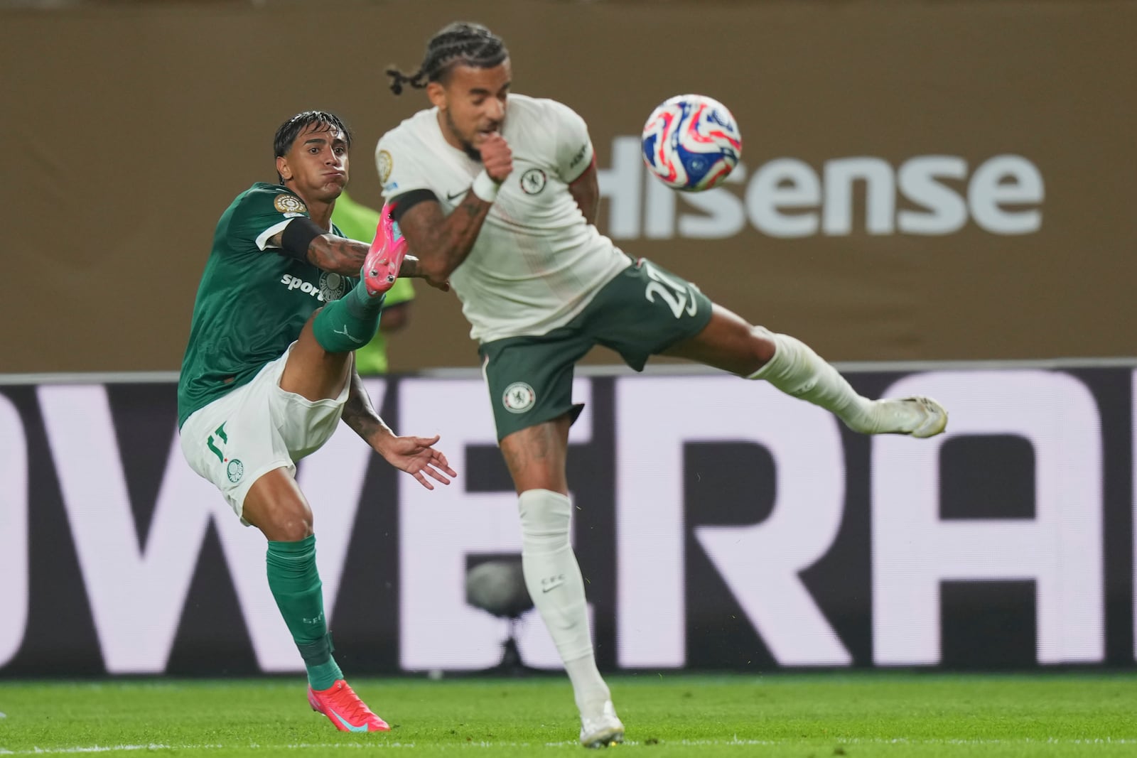Palmeiras' Facundo Torres, left, and Chelsea's Malo Gusto fight for the ball during the Club World Cup quarterfinal soccer match between Palmeiras and Chelsea in Philadelphia, Friday, July 4, 2025. (AP Photo/Chris Szagola)