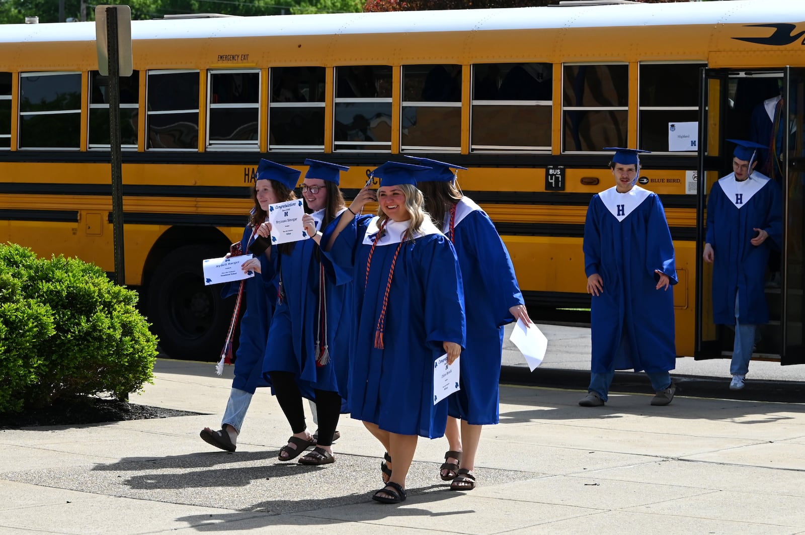 Hamilton City School's annual tradition of graduating seniors visiting their old elementary schools took place on Wednesday, May 7, 2025. The seniors walked the halls of their old schools with current students lining the walls cheering their accomplishments of graduation. Pictured are students at Highland Elementary School on Main Street in Hamilton. MICHAEL D. PITMAN/STAFF