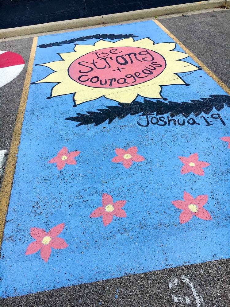 PHOTOS Lakota East seniors paint parking spots