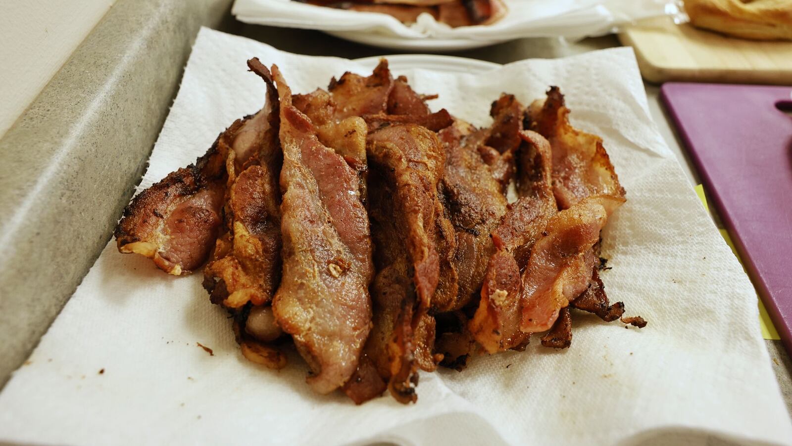 CareFlight registered nurse Mike Moyer often cooks bacon for fellow employees during his morning shift at the CareFlight hangar at Warren County Airport. He buys only thick-cut bacon. NICK GRAHAM/STAFF