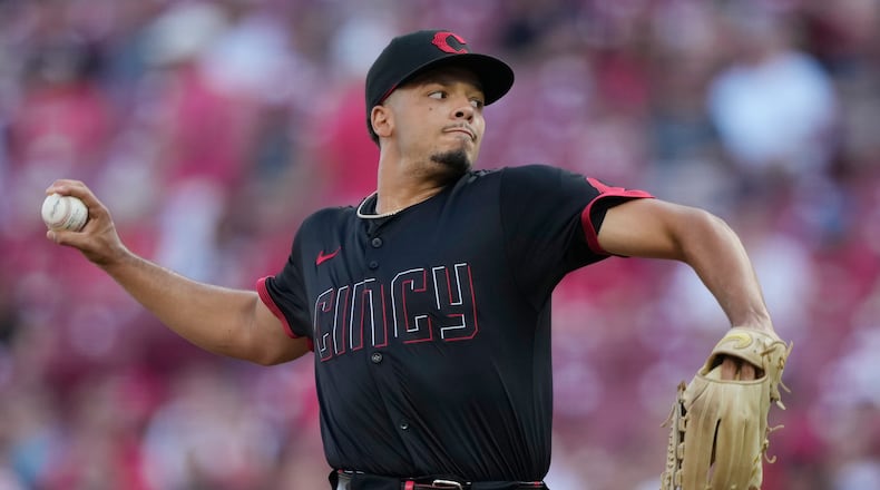 Cincinnati Reds pitcher Chase Burns throws during the first inning of a baseball game against the Colorado Rockies in Cincinnati, Friday, July 11, 2025. (AP Photo/Carolyn Kaster)
