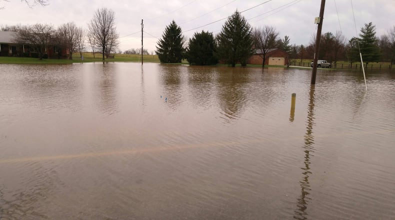 Water covers Millikin Road between Cincinnati-Dayton Road and Yankee Road in Liberty Twp. on Wednesday, March 1. This is a common problem area during heavy rain. NICK GRAHAM/STAFF