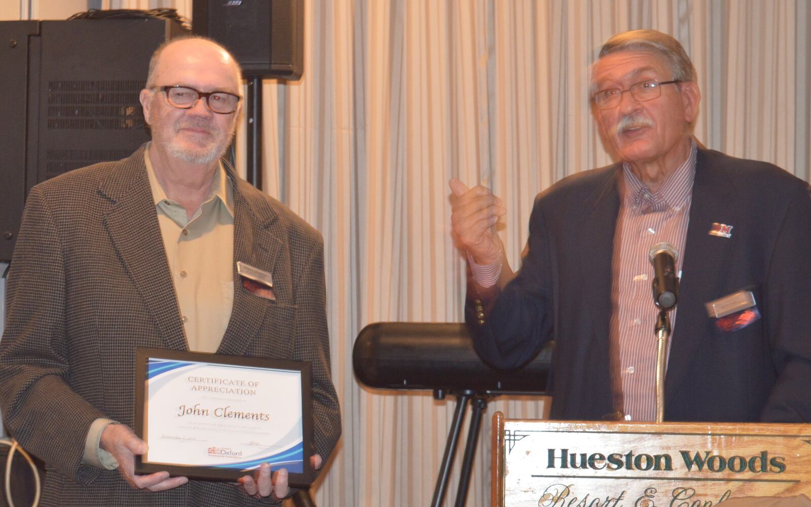 John Clements, left, served on the board of the Greater Oxford Area Community Foundation for nine years and was recognized for this service at the 25-year celebration. The presentation was made by board President Bob Carmean. CONTRIBUTED/BOB RATTERMAN