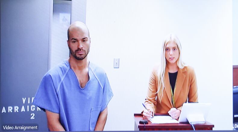 Michael Kendrick (left) appeared electronically before Magistrate Brandon McClain in Dayton Municipal Court on Tuesday, July 15. McClain set his bond at $2 million. He is facing three counts of tampering with evidence and one count gross abuse of a corpse for allegedly leaving the body of a 7-year-old boy in grass field in Dayton before collecting his bones. BRYANT BILLING / STAFF