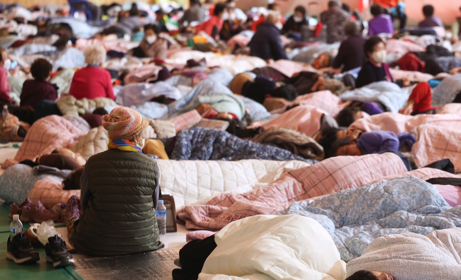 Escaped villagers from wildfires take rest at a shelter in Yeongyang, South Korea, Wednesday, March 26, 2025. (Yun Kwan-shik/Yonhap via AP)