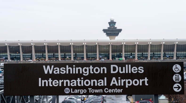 FILE - A sign of Washington Dulles International Airport station is seen during the opening of new Silver Line Extension at Washington Dulles International Airport, in Chantilly, Va., Nov. 15, 2022. (AP Photo/Jose Luis Magana, File)