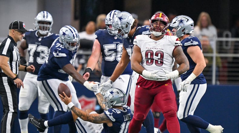 Washington Commanders defensive tackle Jonathan Allen (93) reacts after recording a sack on Dallas Cowboys quarterback Trey Lance during the second half of an NFL football game, Sunday, Jan. 5, 2025, in Arlington, Texas. (AP Photo/Jerome Miron)