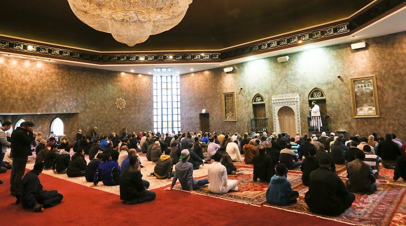 In this 2015 file photo, Shaykh Hamzah Wald Maqbul leads the Friday prayer at the Islamic Center of Greater Cincinnati. GREG LYNCH / STAFF