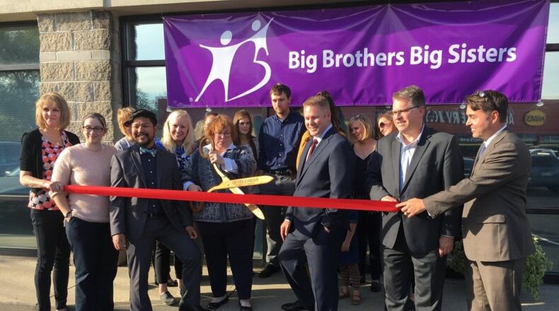 A ribbon-cutting ceremony was held in November at the Big Brothers Big Sisters of Butler County to celebrate its new office location in Hamilton. Rep. Warren Davidson joined City Manager Joshua Smith at the event held last year. The agency is one of several in the area to receive grant money this year from the CareSource Foundation. FILE