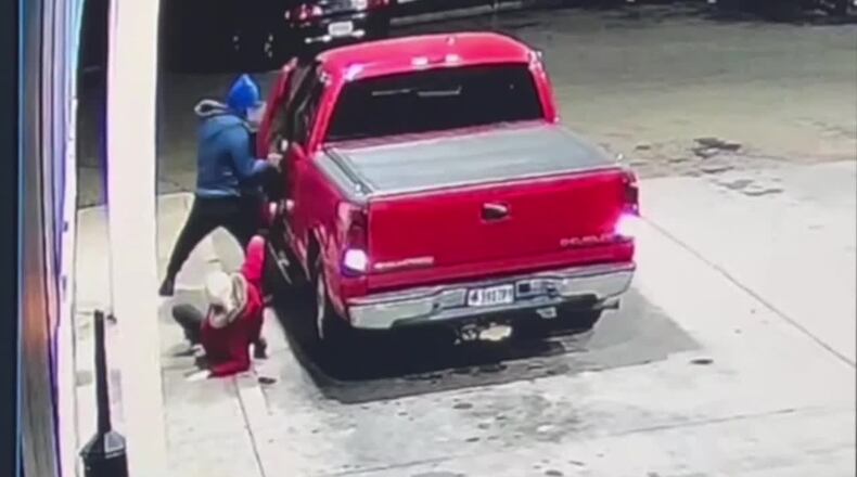 Security video shows a a woman fall to the ground while trying to stop a carjacking Tuesday, Jan. 2, 2024, at a Marathon station in Ross. Twp. CONTRIBUTED