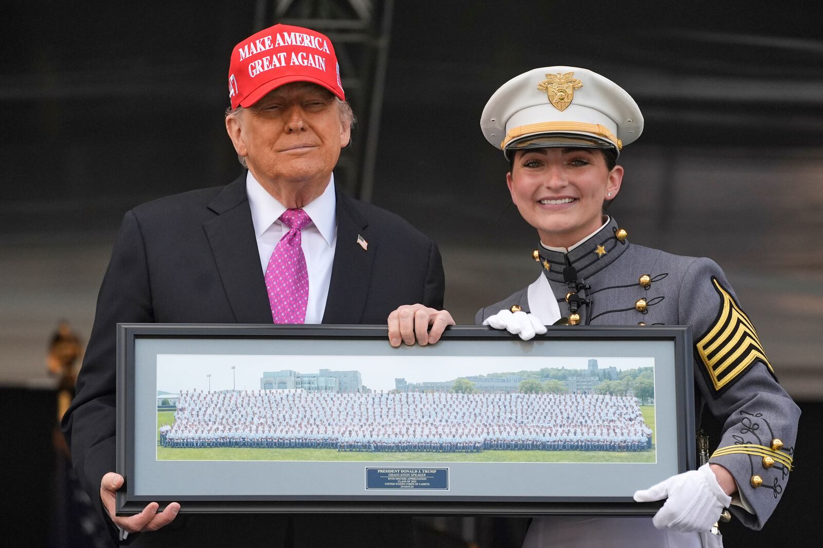 Class President Katherine LaReau, right, poses with President Donald Trump as she presents the class gift to Trump at the United States Military Academy commencement ceremonies in West Point, N.Y., Saturday, May 24, 2025. (AP Photo/Manuel Balce Ceneta)