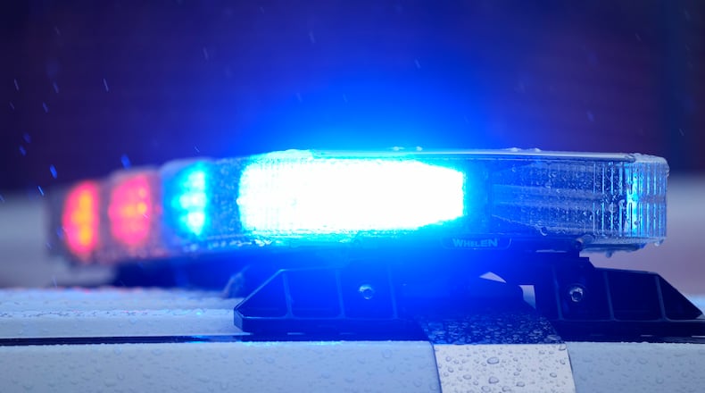 Lights on a parked police vehicle flash at scene of a fatal shooting in Philadelphia, Friday, April 28, 2023. (AP Photo/Matt Rourke)