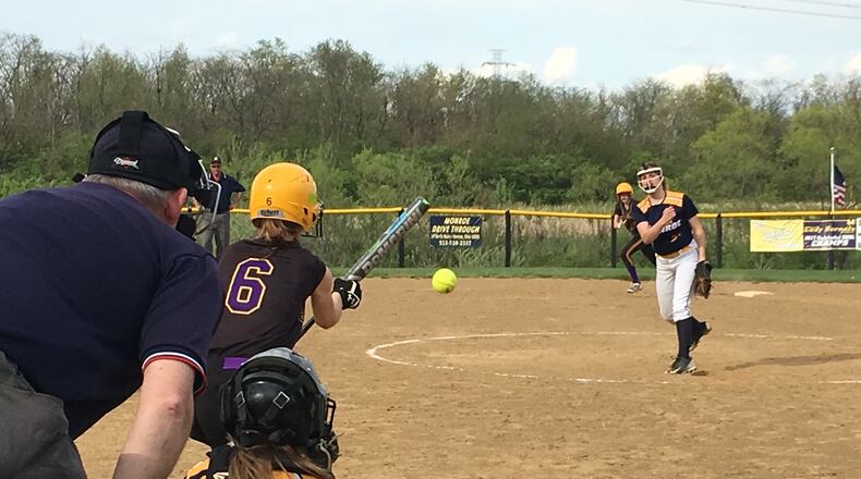 Monroe’s Alyssa Wagner delivers a pitch toward catcher Sam Schwab as Bellbrook’s Savannah Geldbaugh (6) prepares to bunt May 3 at Monroe. RICK CASSANO/STAFF