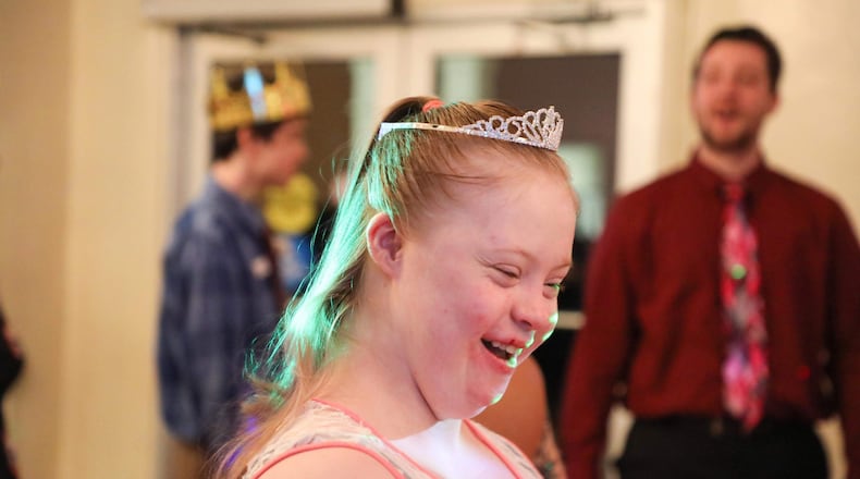 Lillian Mumphrey is all smiles after being crowned queen during a formal dance for students with special needs.