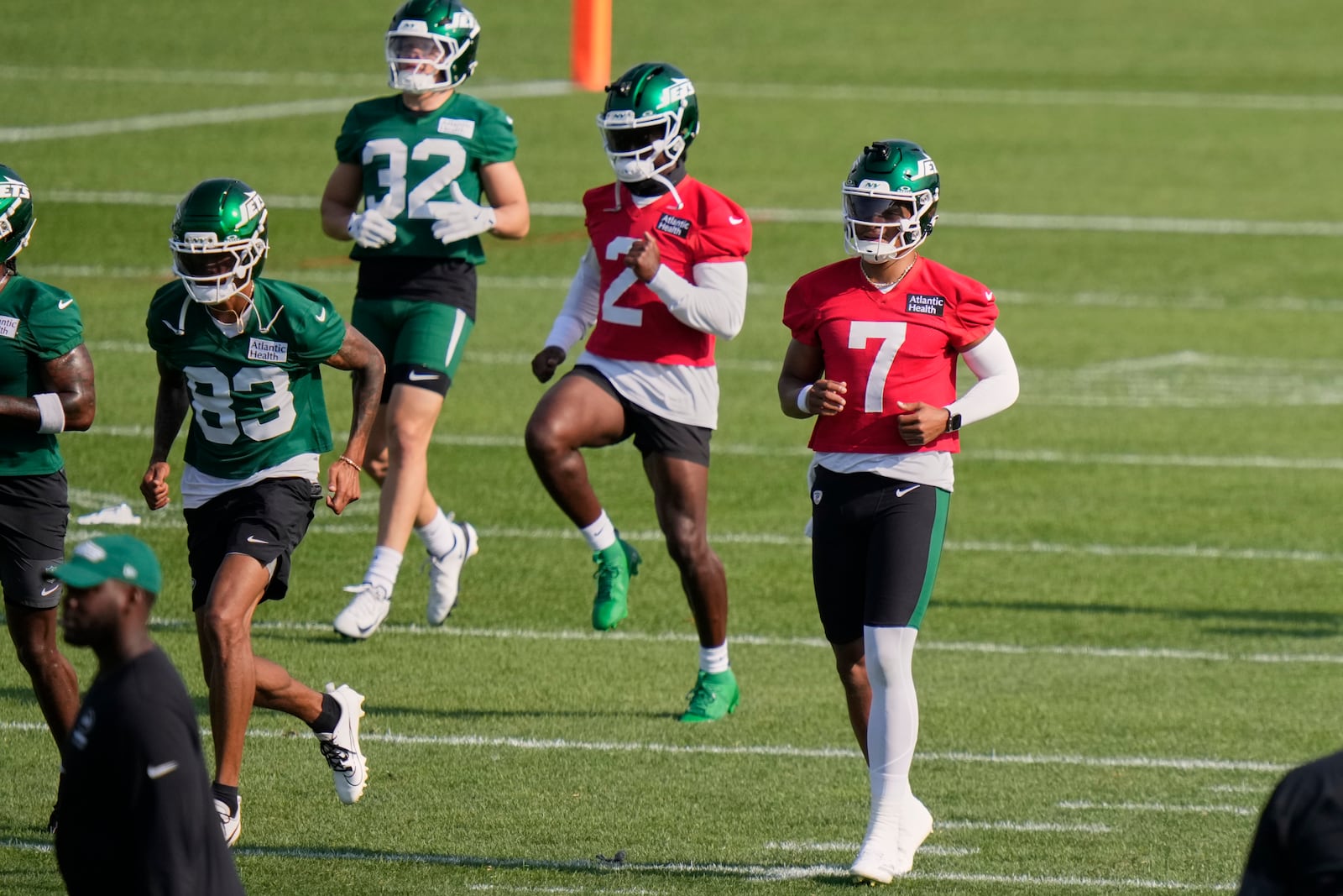 New York Jets quarterbacks Justin Fields (7) and Tyrod Taylor (2) take part in drills at the NFL football team's training camp Thursday, July 24, 2025, in Florham Park, N.J. (AP Photo/Frank Franklin II)