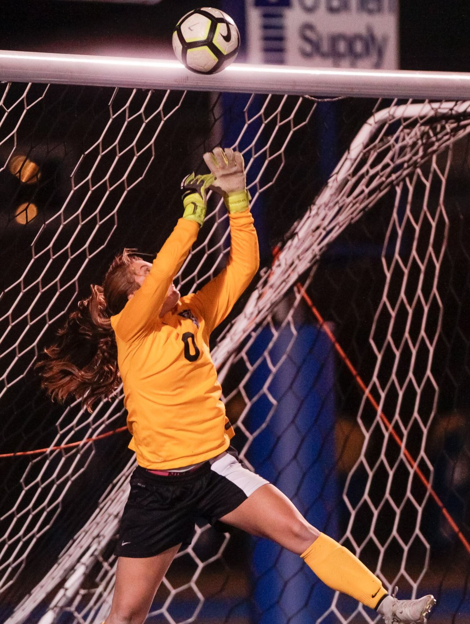 Lakota East goalkeeper Madison Hart deflects a shot during Tuesday night’s 2-1 overtime win over Fairfield in a Division I sectional girls soccer final at Hamilton’s Virgil Schwarm Stadium. NICK GRAHAM/STAFF