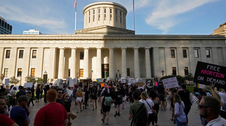 FILE - Protesters rally at the Ohio Statehouse in Columbus, Ohio, in support of abortion after the U.S. Supreme Court overturned Roe vs. Wade on June 24, 2022. A judge temporarily blocked Ohio’s ban on virtually all abortions, Wednesday, Sept. 14, 2022, again pausing a law that took effect after federal abortion protections were overturned by the Supreme Court in June. (Barbara J. Perenic /The Columbus Dispatch via AP, File)