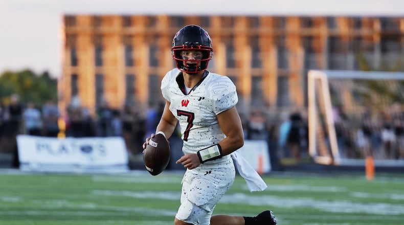 Lakota West quarterback Mitch Bolden looks for a pass during their 49-6 win over Lakota East in their football game Friday, Aug. 26, 2022 at Lakota East High School in Liberty Township. NICK GRAHAM/STAFF